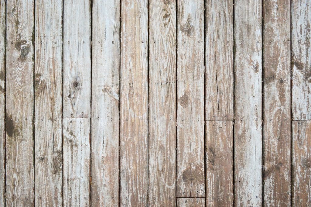 how-to-strip-a-deck-before-detail-1024x681-1 Worn wood deck with splotchy stain finish