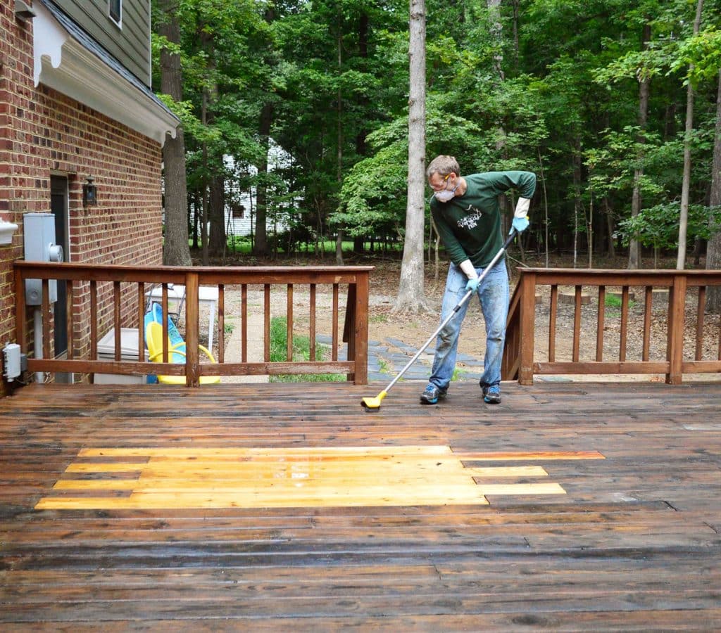 how-to-strip-a-deck-john-scrubbing-cleaner-1024x900-1 John scrubbing wood deck with deck brightener cleaner
