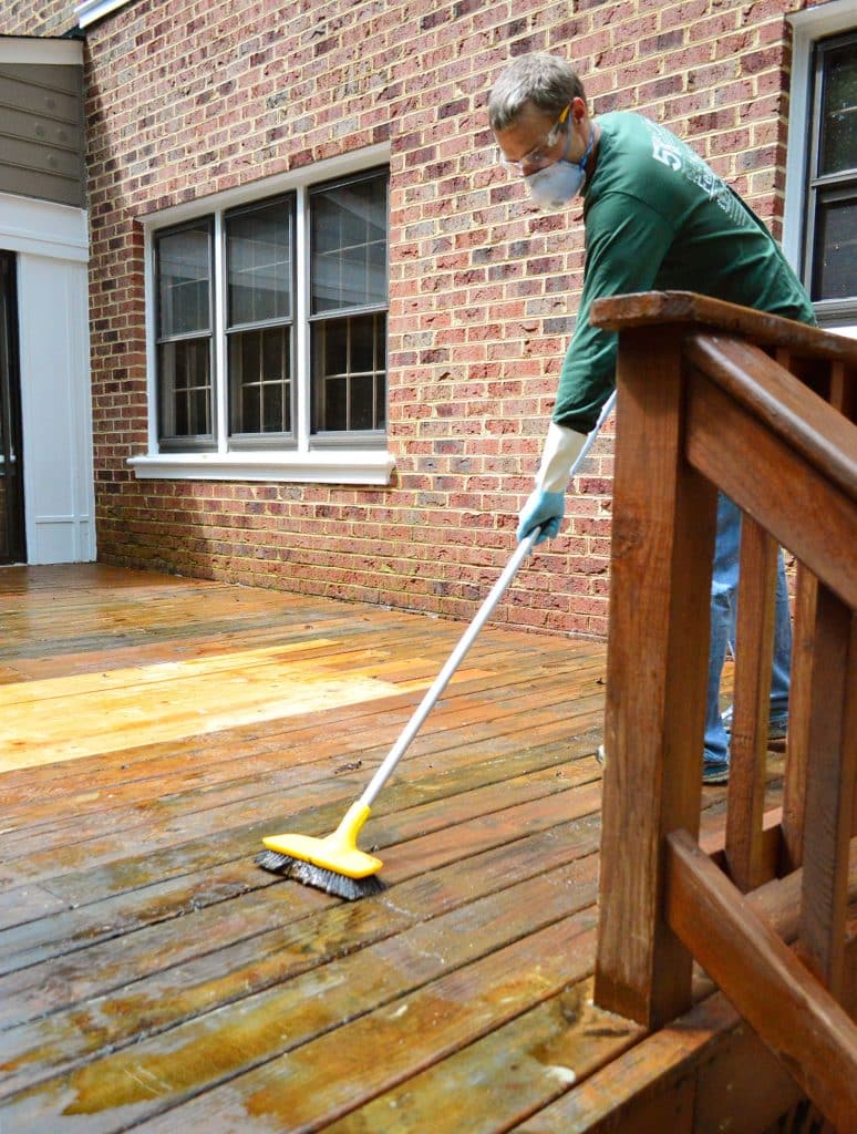 how-to-strip-a-deck-john-scrubbing-with-brush-774x1024-1 John Scrubbing wood deck to remove old finish with stiff brush