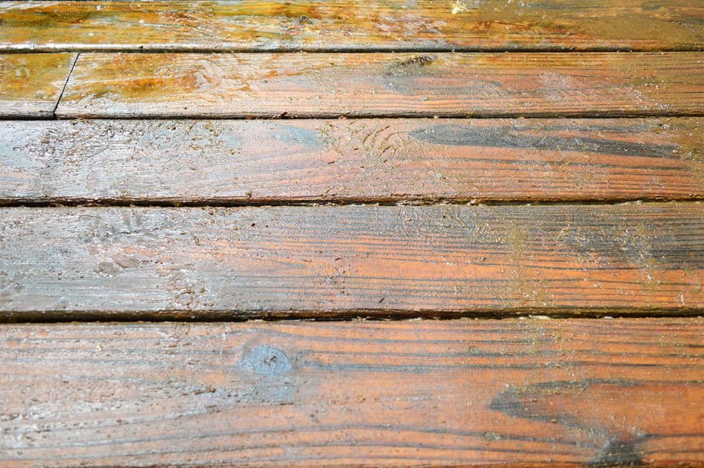 how-to-strip-a-deck-stripper-chemical-a-twork-1024x681-1 Detail of deck finish stripper peeling old stain finish off wood deck
