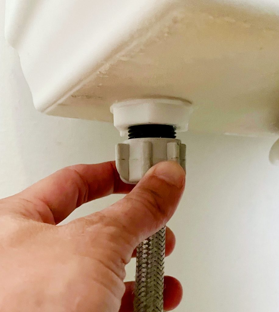 install-a-toilet-disconnect-water-line-916x1024-1 Hand Loosening Water Supply Line Under Toilet Tank