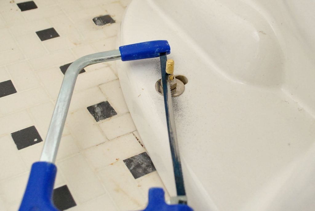install-a-toilet-hacksaw-bolt-1024x687-1 Hacksaw Removing Excess Bolt Length On New Toilet