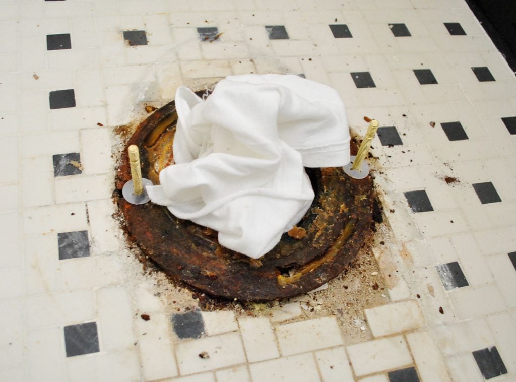 install-a-toilet-new-bolts-in-flange-1024x758-1 New Bolts On Toilet Flange With Rag In Sewer Hole