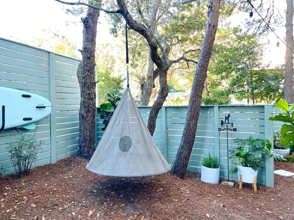 kitcen-porch-after-towrds-three-trees-and-fence-1024x768-1 Side yard area with hanging tent swing near fence