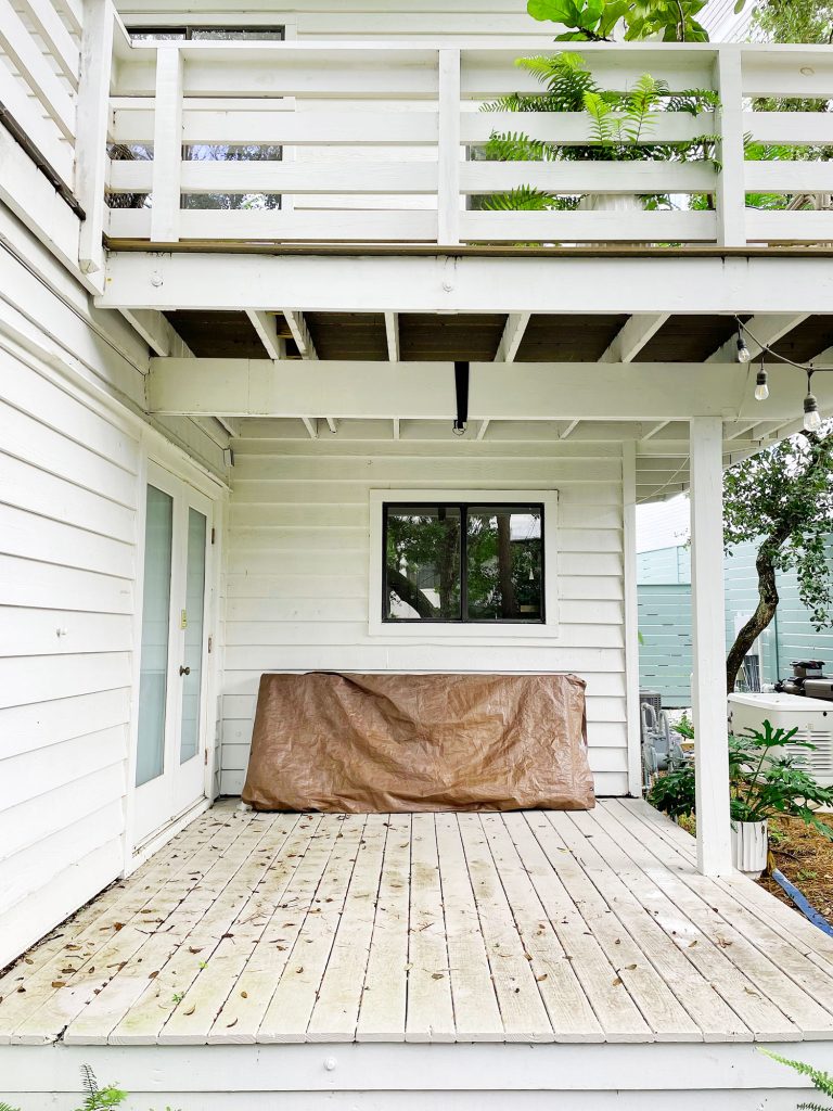 kitchen-porch-before-new-deck-768x1024-1 Midpoint photo of cover porch with stained painted floor and no furniture
