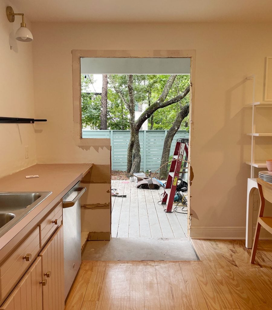 kitchen-porch-from-inside-with-wall-being-cut-for-door-900x1024-1 View from within kitchen as new doorway was cut in the wall