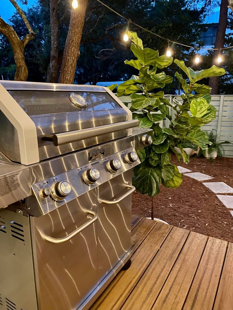 kitchen-porch-grill-at-night-768x1024-1 Detail photo of stainless steel grill at night