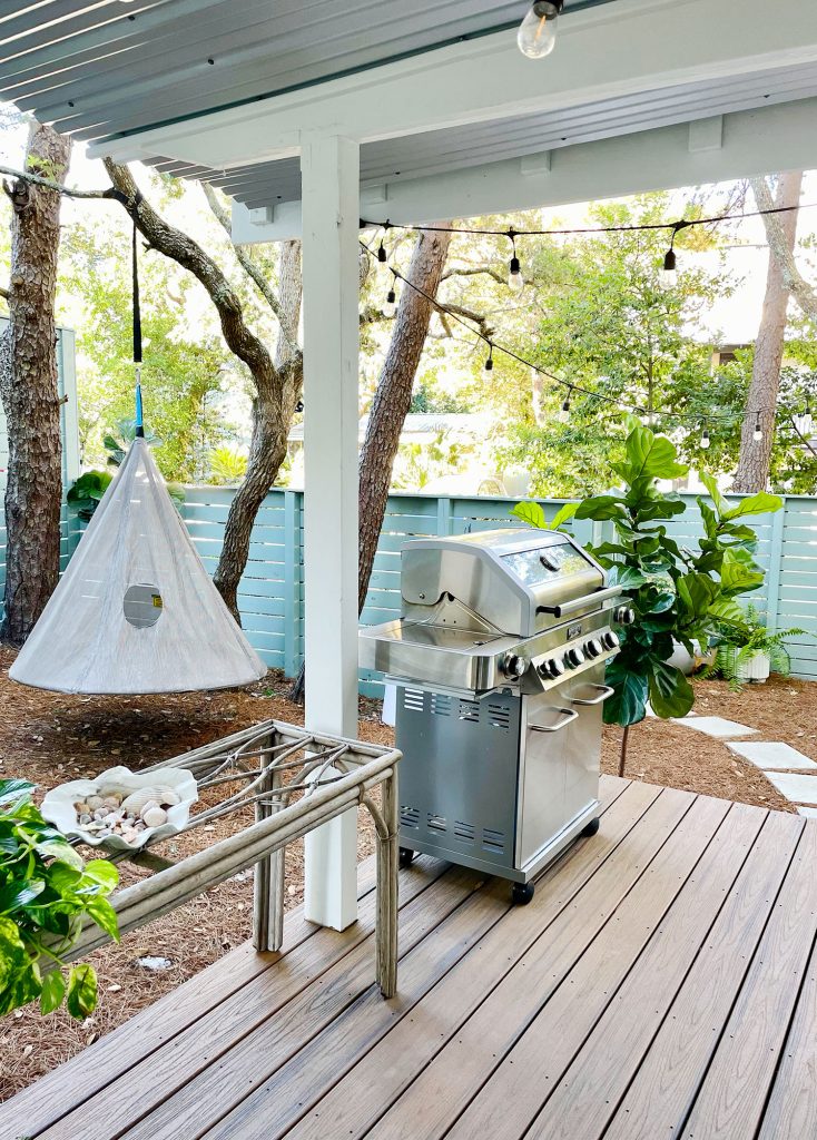 kitchen-porch-left-side-towads-swing-734x1024-1 View of side yard with hanging swing and grill