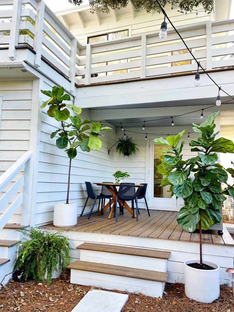 kitchen-porch-towards-left-side-wall-768x1024-1 After photo from same view with white house string lights and fig trees