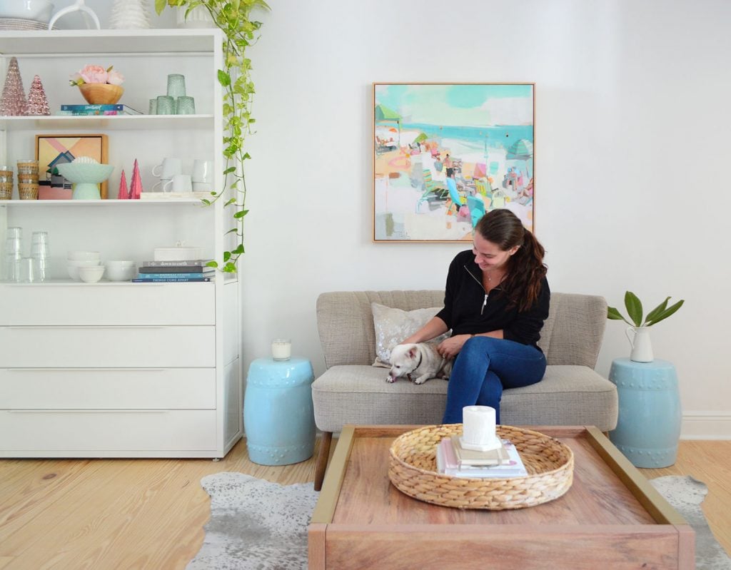 kitchen-seating-area-with-sherry-burger-1024x799-1 Sherry sitting on settee with chihuahua next to white metal shelf