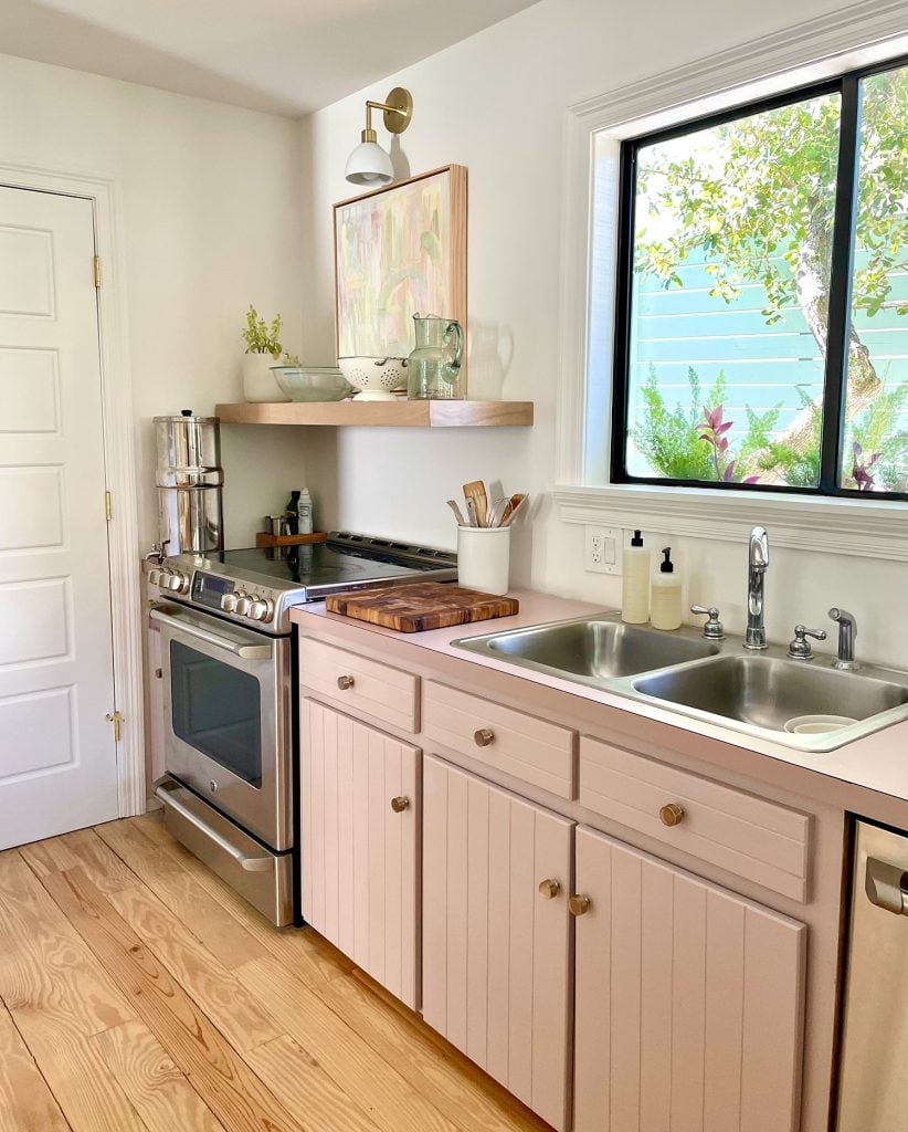 kitchen-update-oven-corner-with-berkey-and-sconce-822x1024-1 Beachy Kitchen With Mauve Pink Cabinets And Wood Floating Shelves With Mid Century Modern Lights