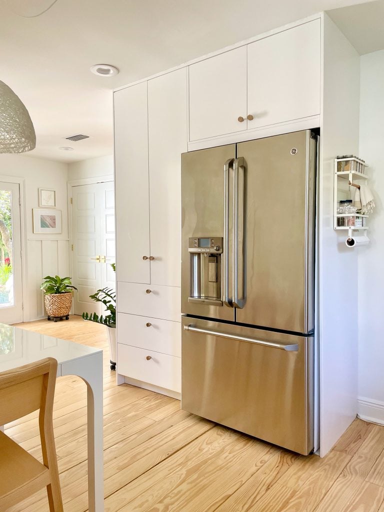 kitchen-update-pantry-shot-with-door-in-background-768x1024-1 Ikea Built-In Pantry Cabinets Around Stainless Steel Refrigerator