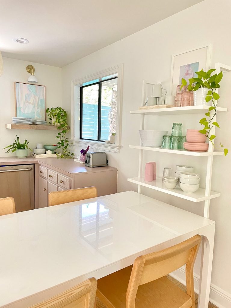 kitchen-update-shelf-corner-shot-768x1024-1 White CB2 Breakfast Table Against White Wall Shelf With Bowls And Cups
