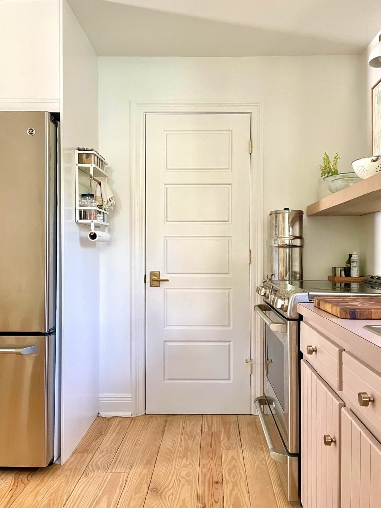 kitchen-update-utility-room-door-768x1024-1 White Door To Kitchen Utility Closet With Spice Rack On Pantry Side