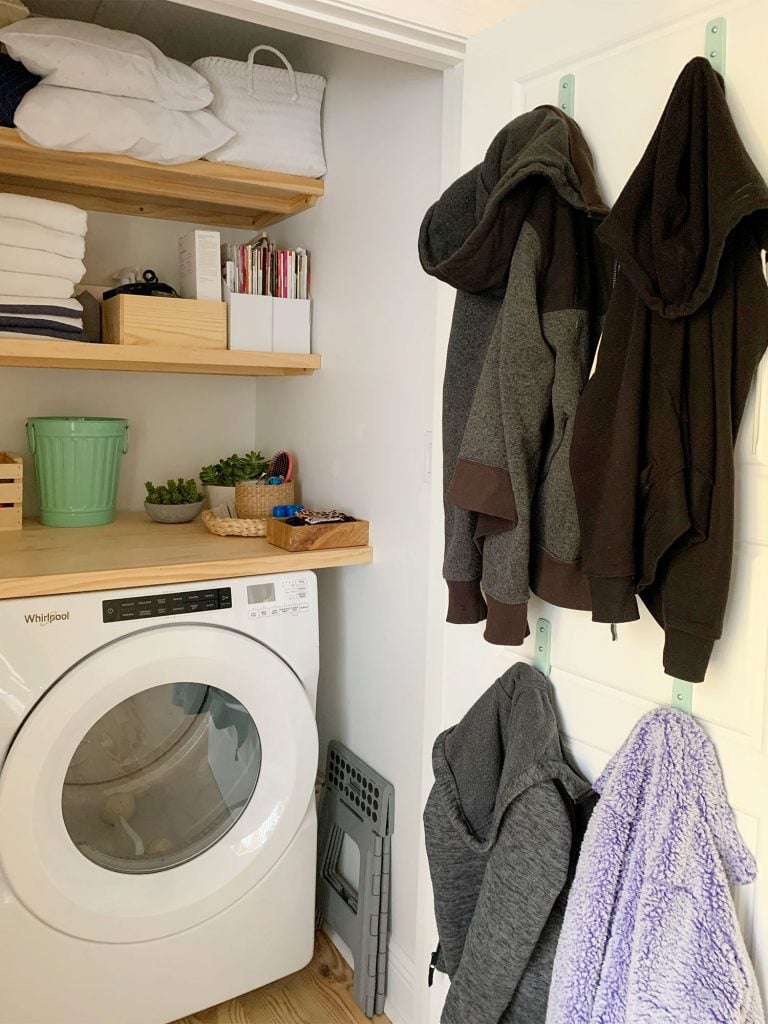 loveseat-laundry-closet-wide-shot-768x1024-1 Coats hung on back of laundry closet door