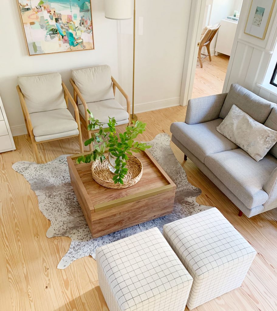 loveseat-sitting-area-from-stairs-912x1024-1 Overhead view of sitting area with wood coffee table in middle