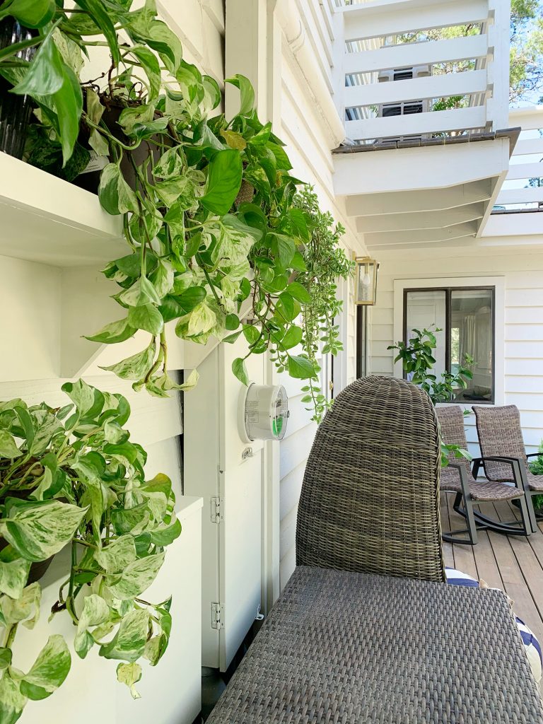 plant-shelves-on-porch-side-shot-vertical-768x1024-1 Side View Of Plant Shelf Covering Electrical Boxes