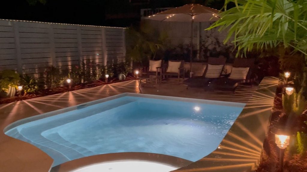 pool-night-solar-lights-screenshot-1024x576-1 Small freeform pool at night with pool lights and solar lights on