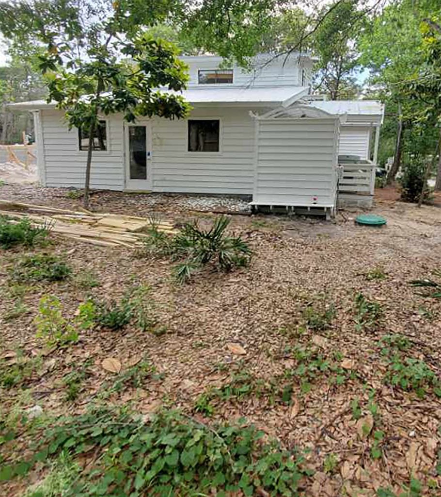 pool-post-before-towards-house-shot-910x1024-1 Before photo of white house with dirt and weedy yard