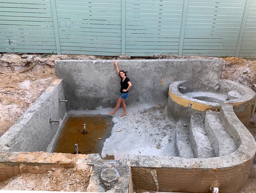pool-post-poured-shotcrete-sherry-for-scale-1024x773-1 Sherry standing in concrete pool form
