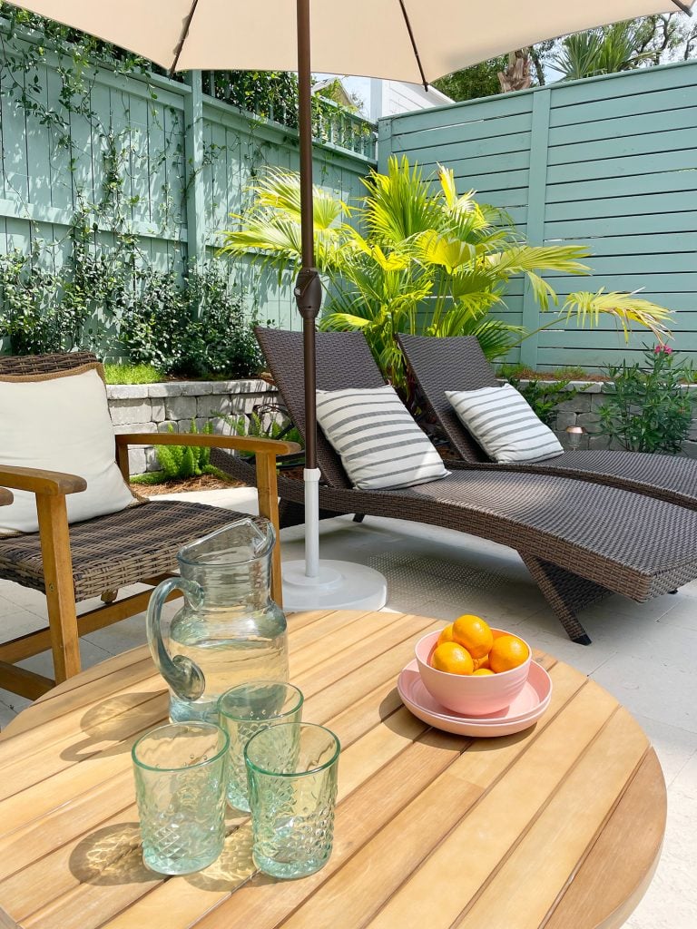 pool-post-vertical-after-sitting-area-detail-shot-768x1024-1 Pool patio area with brown chairs and wicker lounge chairs under umbrella