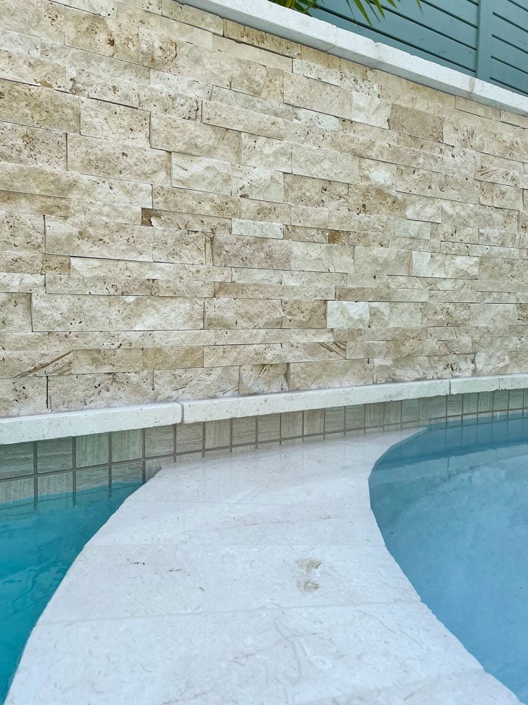 pool-tile-detail-768x1024-1 Detail photo of accent wall stacked natural stone tile and neutral waterline tile