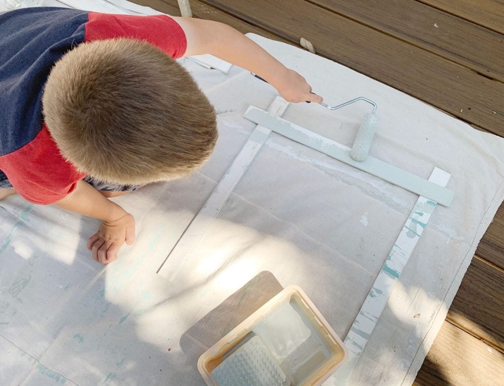 rainbow-stripe-wall-kid-painting-1024x784-1 Young Boy Painting Wood Piece With Small Foam Roller