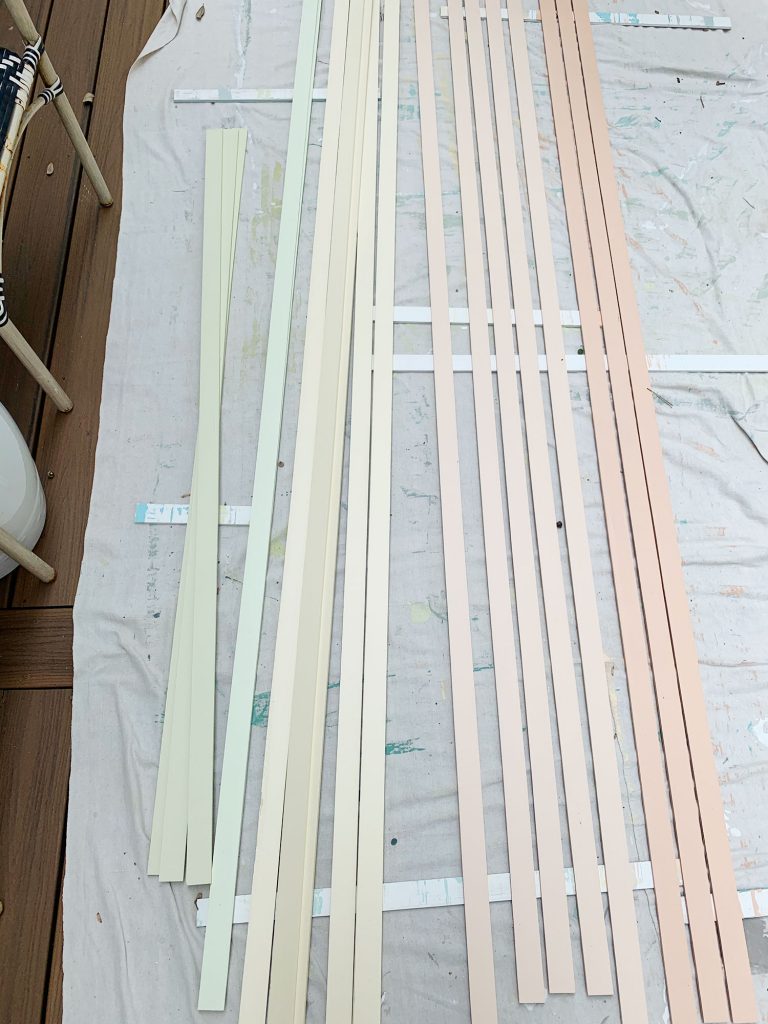 rainbow-stripe-wall-long-pieces-painted-768x1024-1 Orange Yellow And Green Painted Lattice Pieces Laid Out To Dry