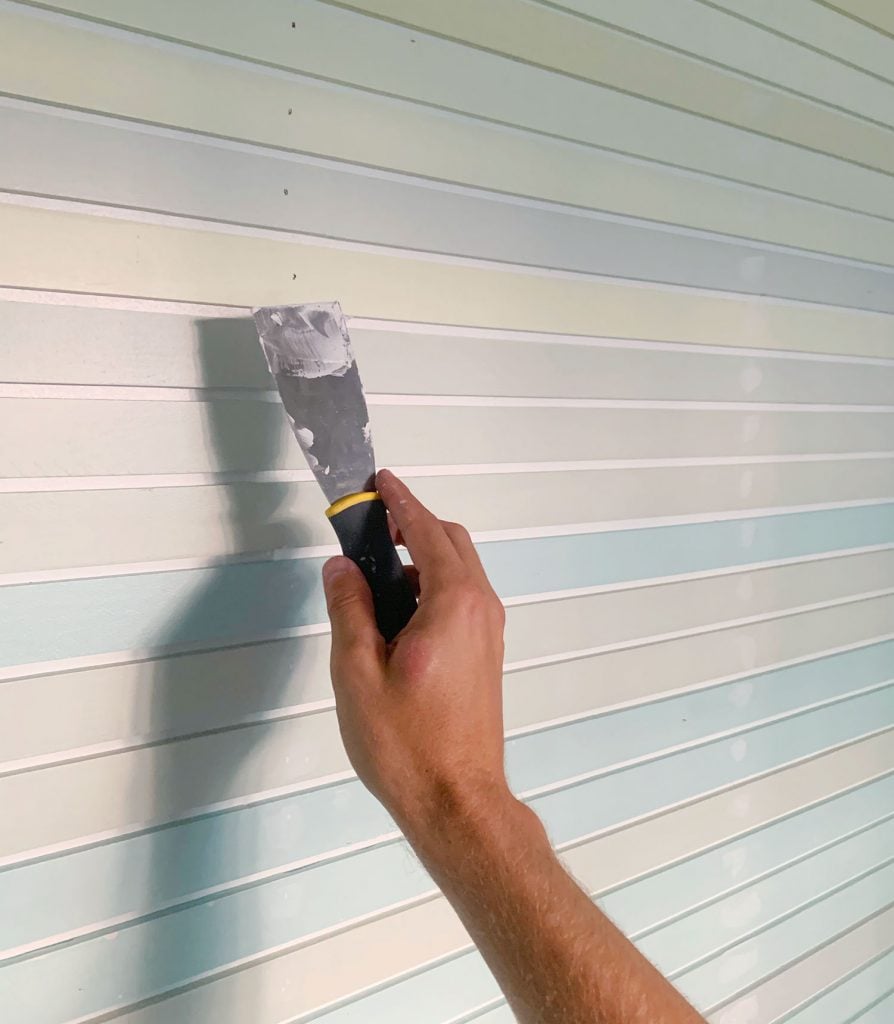 rainbow-stripe-wall-spackling-holes-894x1024-1 Hand Spackling Nail Holes On Striped Wall Treatment