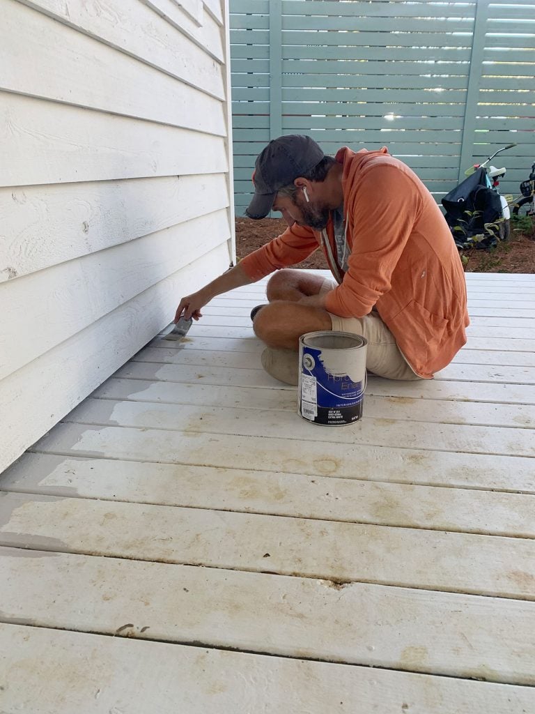side-porch-painting-john-vertical-768x1024-1 John edging porch floor with gray floor paint on paintbrush