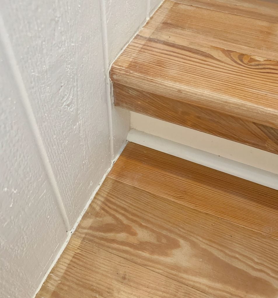 sisal-stair-runner-bad-stain-on-stairs-953x1024-1 Close Up Photo Of Wood Stairs With Discolored Border