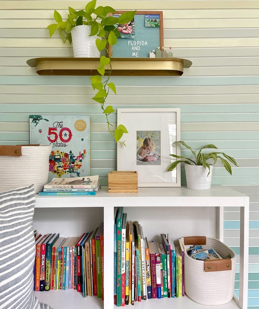 small-colorful-bedroom-built-in-bookcase-closer-858x1024-1 Shelf Detail Of Built In Bookcase Full Of Books And Toys