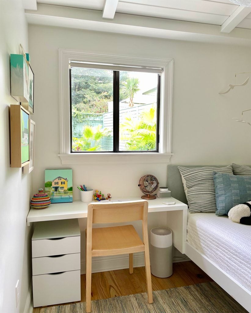 small-colorful-bedroom-built-in-desk-between-bed-and-wall-822x1024-1 Small Kids Room With Built In Desk Next To Bed