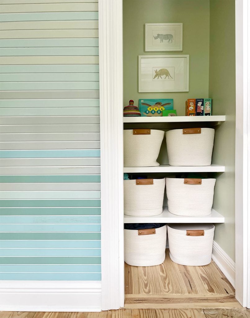 small-colorful-bedroom-custom-closet-shelves-detail-806x1024-1 Painted Closet With Custom DIY Shelves And Art Hanging Above Them