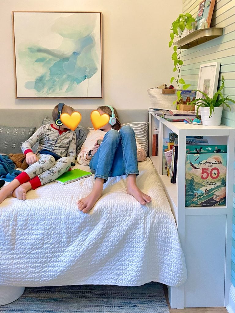 small-colorful-bedroom-fav-hangout-spot-768x1024-1 Built In Bookcase In Small Kids Room With Two Kids On The Bed
