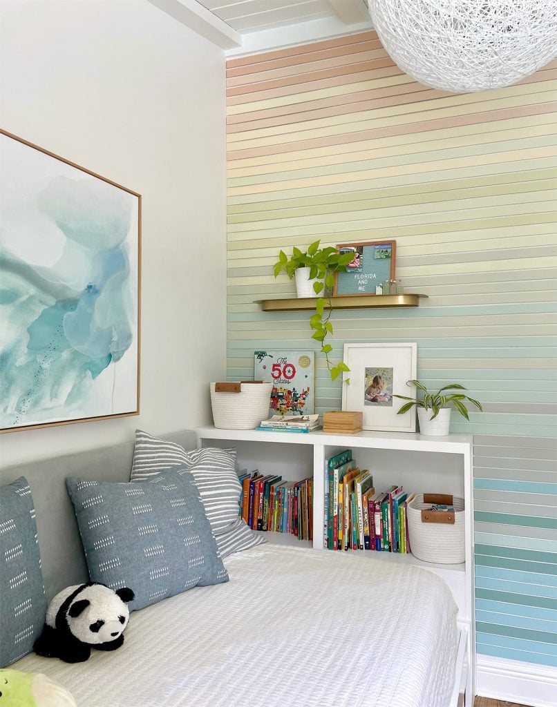 small-colorful-bedroom-large-art-built-in-bookcase-806x1024-1 Small Kids Bedroom With Built In Bookcase And Colorful Wood Wall