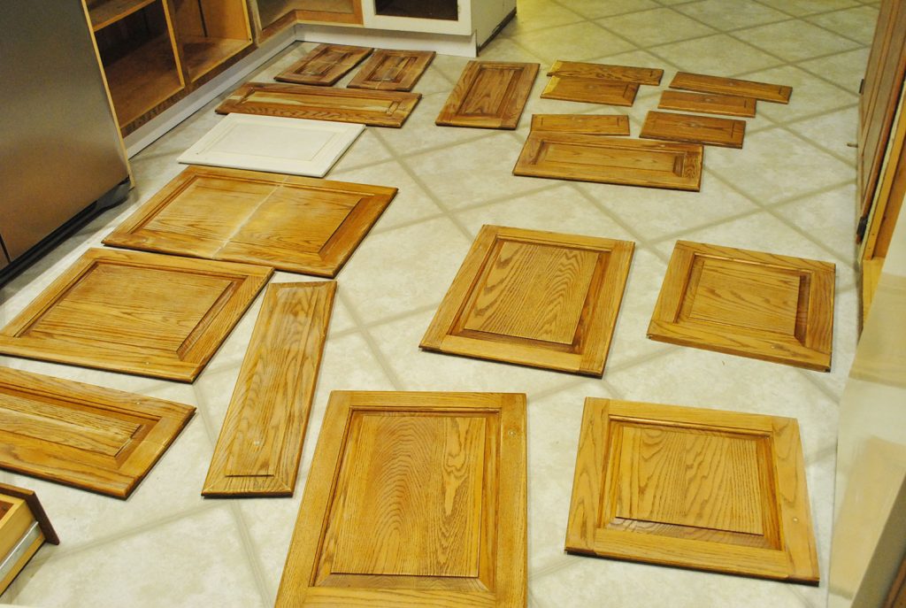 step-1-remove-cabinets-and-hardware-to-paint-1024x687-1 Cabinet Doors Spread Out On Kitchen Floor For Painting