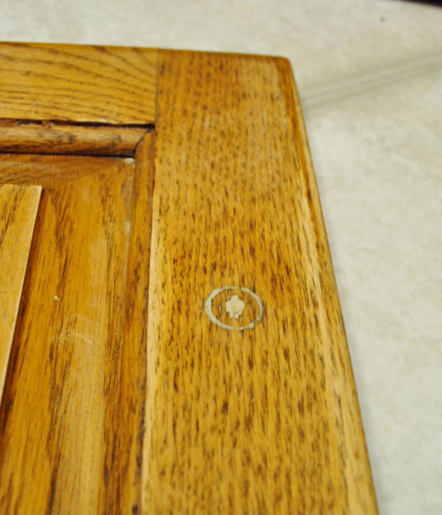 step-2-patching-hardware-holes-on-painted-cabinet-879x1024-1 Cabinet Hardware Hole Filled In With Wood Filler